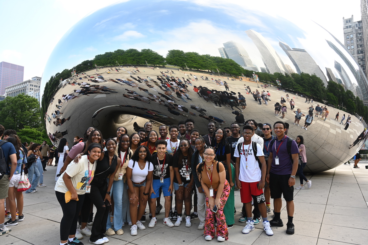 Students pose by Cloud Gate "The Bean"